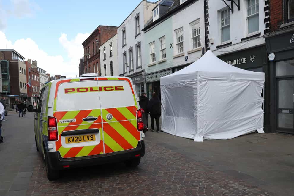 A police tent outside The Clean Plate cafe in Southgate Street, Gloucester