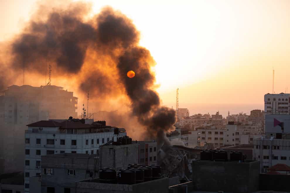 Smoke is seen from a collapsed building after it was hit by Israeli airstrikes on Gaza City