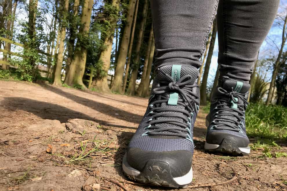 Walking in a pair of new walking boots on a wooded path (Hannah Stephenson/PA)
