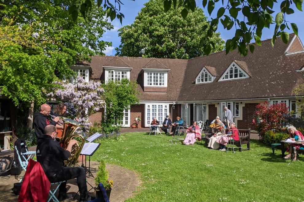 Albert's Band perform to residents in the garden at Compton Lodge care home