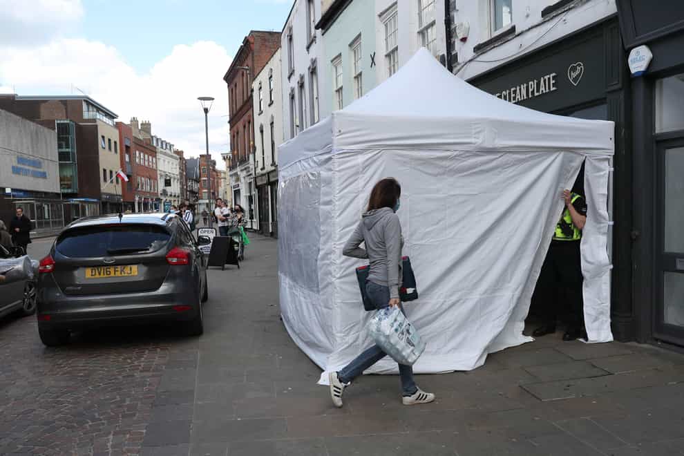A police tent outside the Clean Plate cafe in Southgate Street, Gloucester