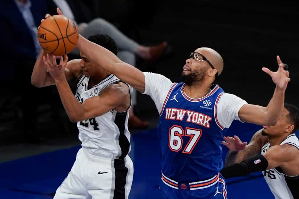 New York Knicks’ Taj Gibson (67) steals the ball from San Antonio Spurs’ Devin Vassell during the Knicks' win on Thursday night