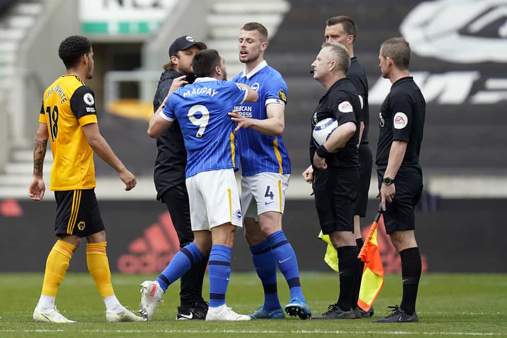 Neal Maupay (centre) was sent off after the final whistle against Wolves