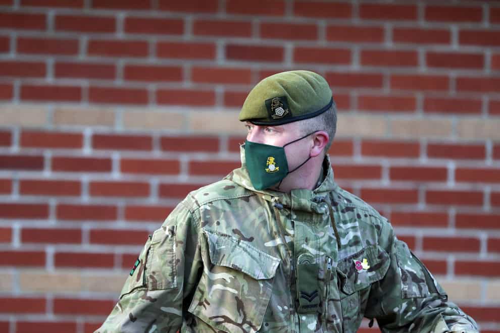 A soldier wearing a face mask
