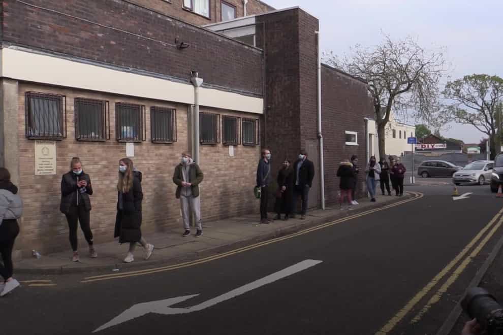 Young people queueing in Sefton, Merseyside