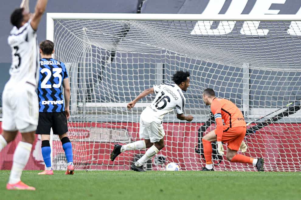 Juventus’ Juan Cuadrado (centre) celebrates after scoring against Inter Milan