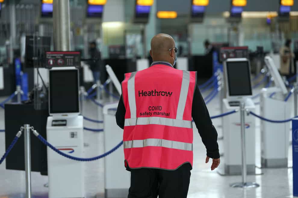 Heathrow Covid marshall patrols the airport