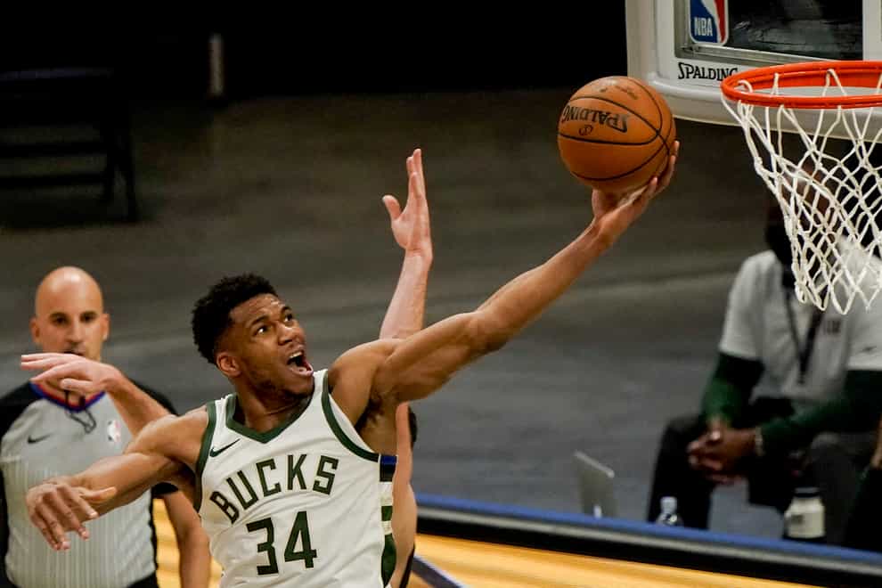 Milwaukee Bucks’ Giannis Antetokounmpo shoots during the first half of an NBA basketball game