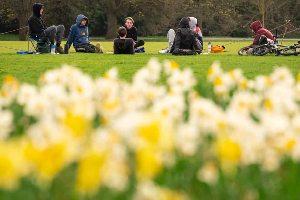 People observe social distancing as they meet up in Greenwich Park