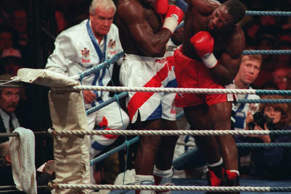 Lennox Lewis defeats Frank Bruno in Cardiff in October 1993