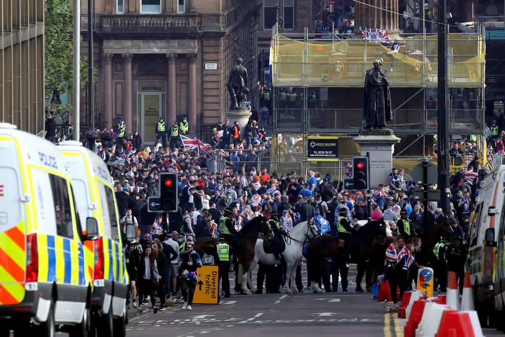 Rangers fans celebrate winning the Scottish Premiership in George Square, Glasgow, after their match against Aberdeen