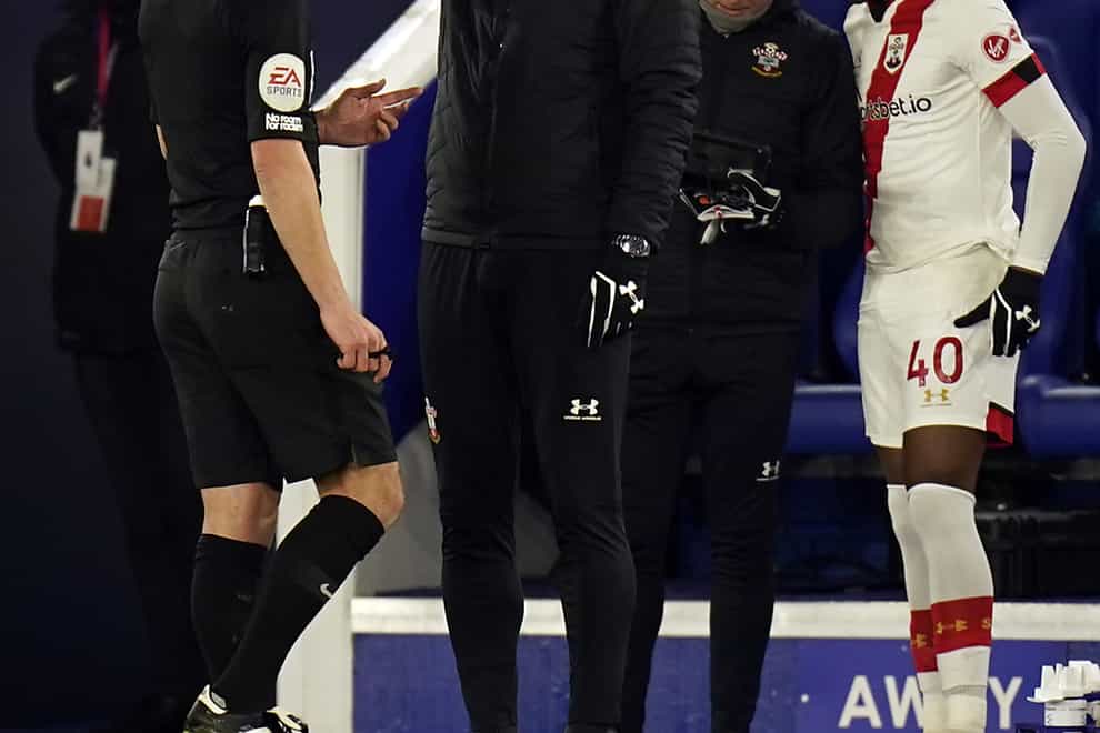 Referee Stuart Attwell speaks to Southampton manager Ralph Hasenhuttl on the touchline