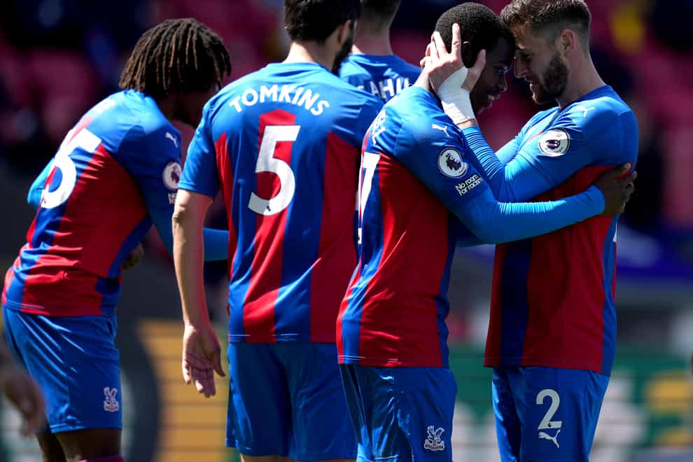 Crystal Palace’s Tyrick Mitchell, second right, celebrates scoring