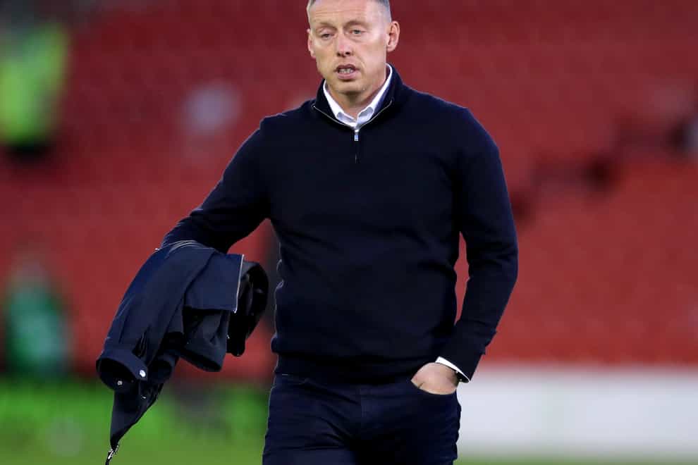 Steve Cooper leaves the Barnsley pitch at half-time