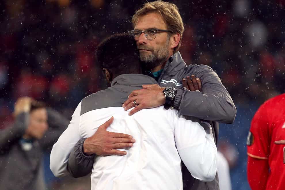 Jurgen Klopp consoles Kolo Toure after Liverpool's loss to Sevilla