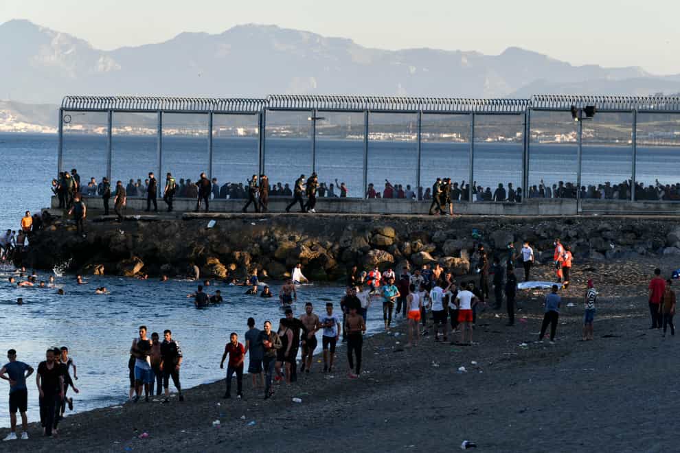 People from Morocco enter the Spanish territory of Ceuta