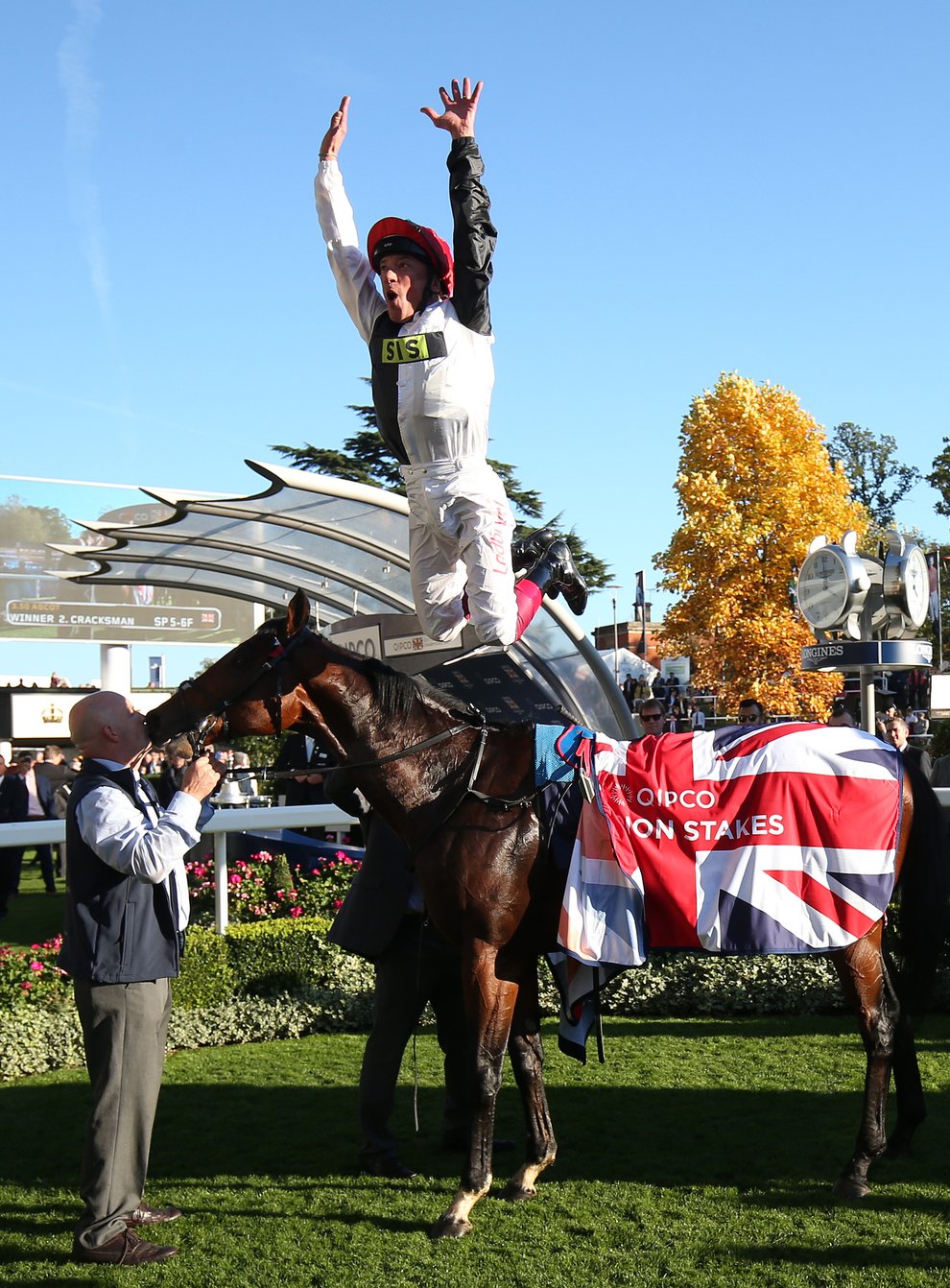 Frankie Dettori jumps off Cracksman after winning the Qipco Champion Stakes