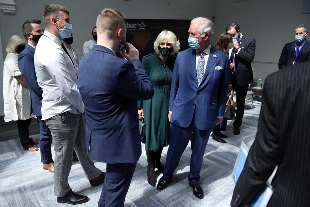 The Prince of Wales and the Duchess of Cornwall during a visit to the Education Authority Headquarters in Belfast (Clodagh Kilcoyne/PA)