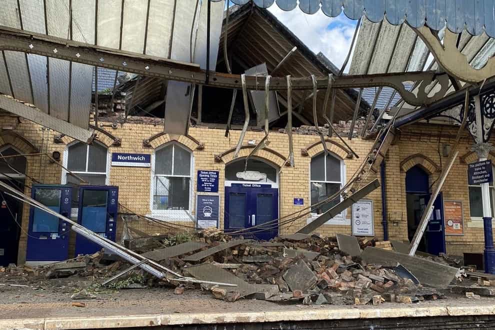 Bricks and other building materials crashed onto a railway station platform when a roof and wall collapsed (Northwich fire station/PA)