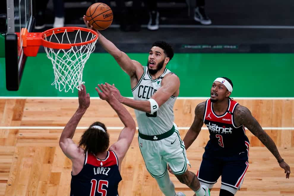 Boston Celtics forward Jayson Tatum drives to the basket against Washington Wizards centre Robin Lopez