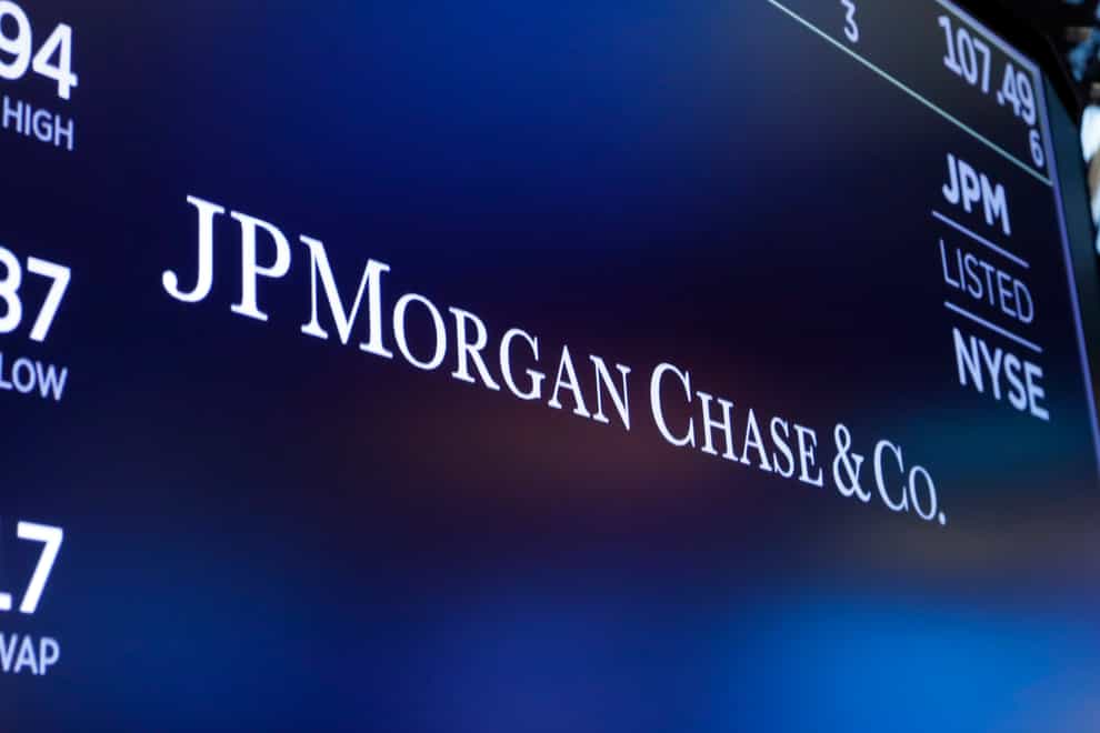 The logo for JPMorgan Chase & Co. appears above a trading post on the floor of the New York Stock Exchange (Richard Drew/AP)