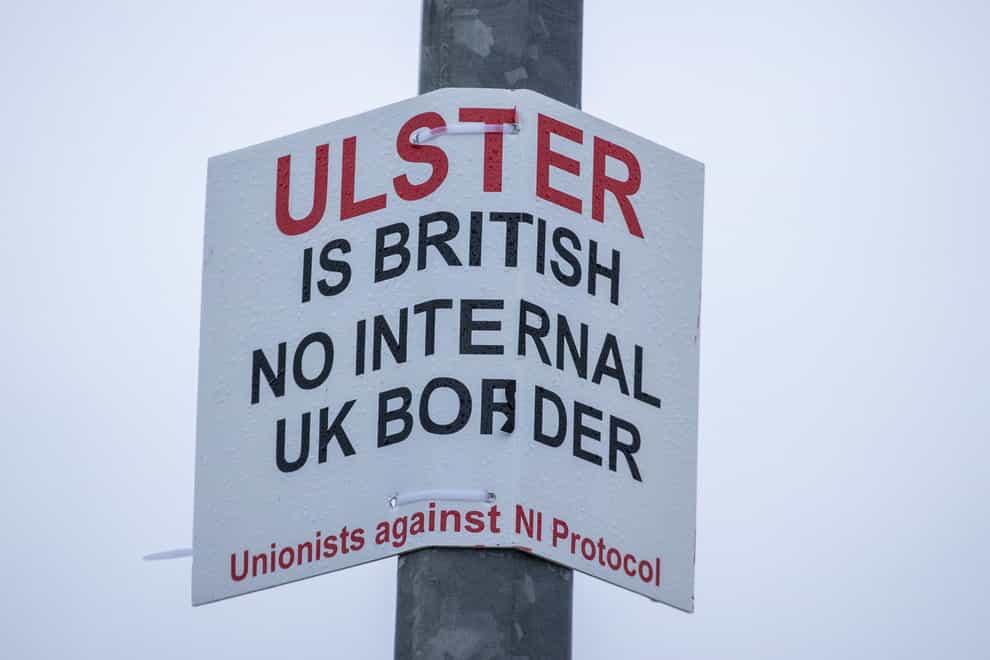 A sign on a lamppost that reads ‘Ulster is British – no internal UK Border – Unionists against NI Protocol’, opposite the Department of Agriculture, Environment and Rural Affairs (DAERA) Redlands site (Liam McBurney/PA)
