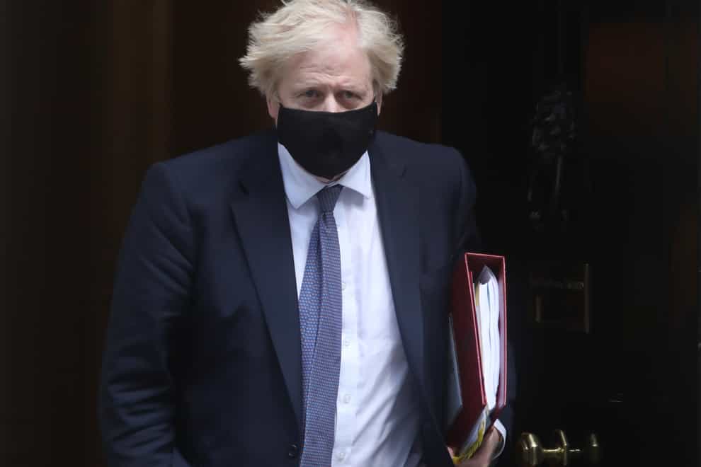 Prime Minister Boris Johnson leaves 10 Downing Street to attend PMQs