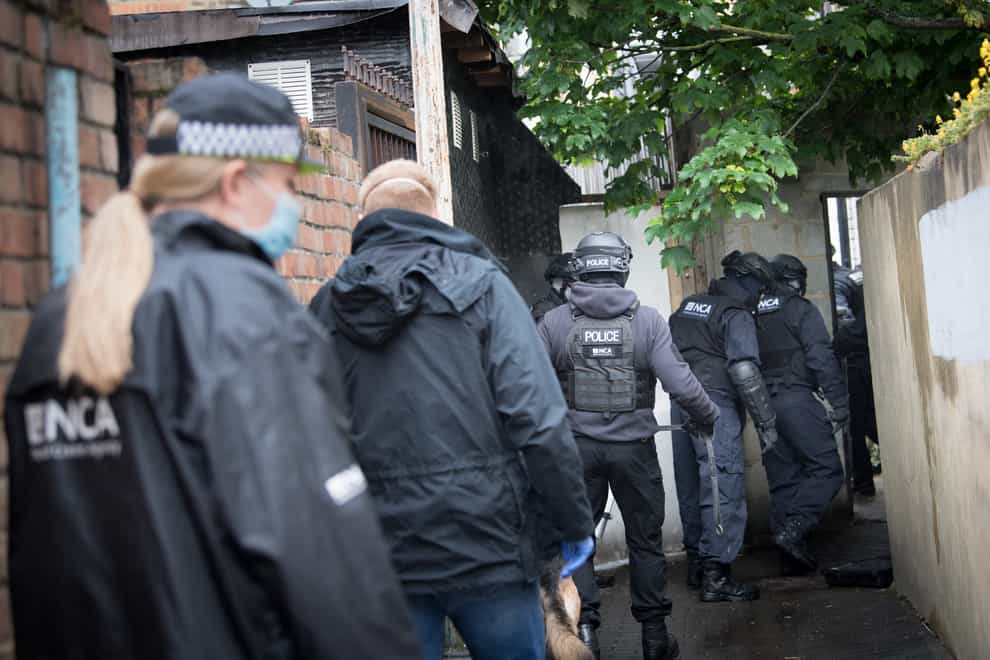 Police during a National Crime Agency operation in east London