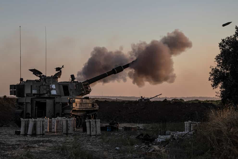 An Israeli artillery unit fires towards targets in the Gaza Strip