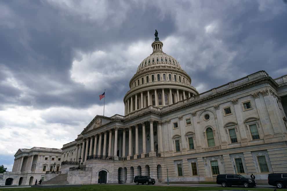 The Capitol is seen under dark skies