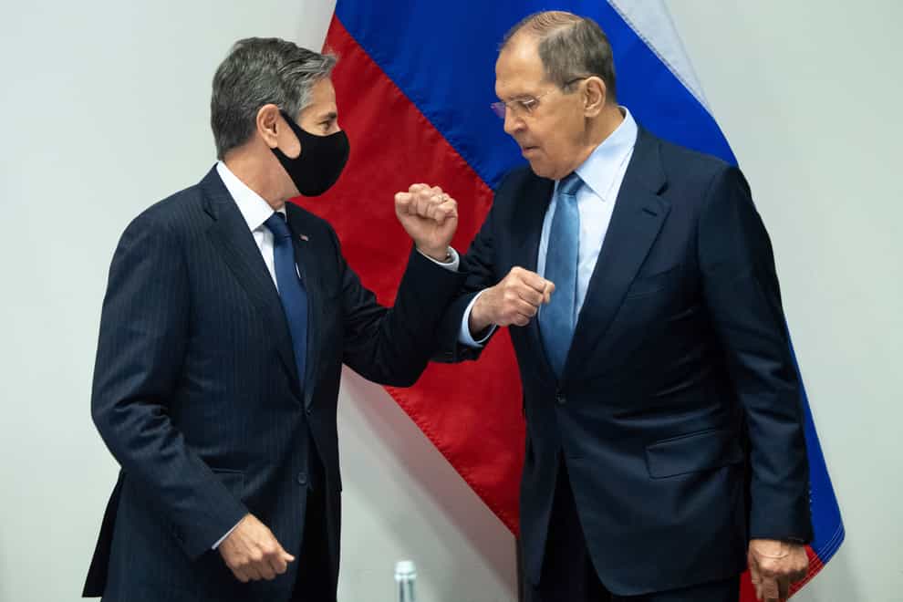 US Secretary of State Antony Blinken, left, greets Russian Foreign Minister Sergey Lavrov in Reykjavik