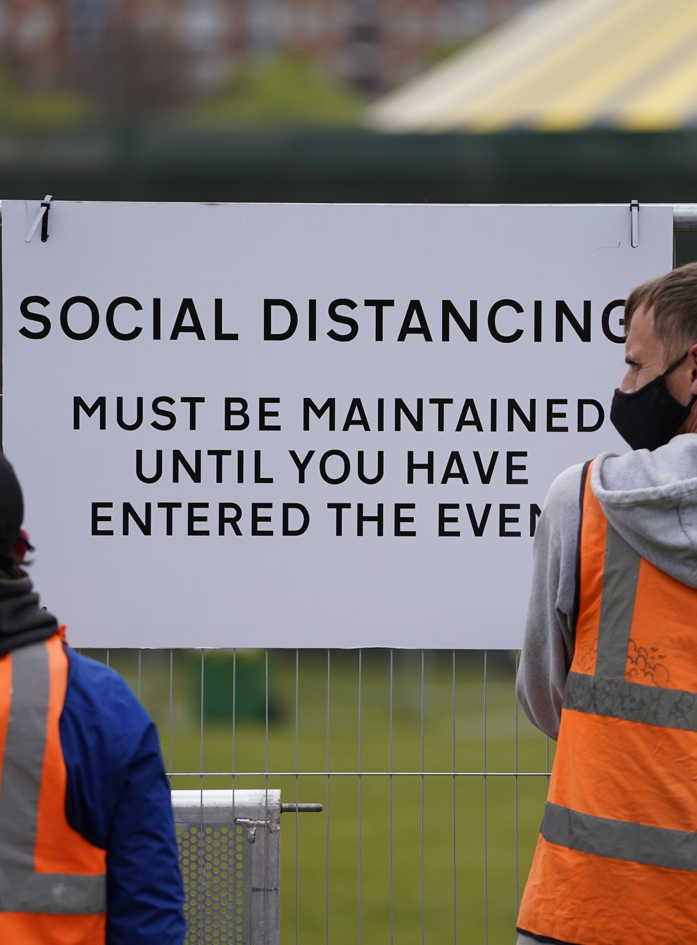 Signage being put up at a music festival in Sefton Park in Liverpool (Danny Lawson/PA)