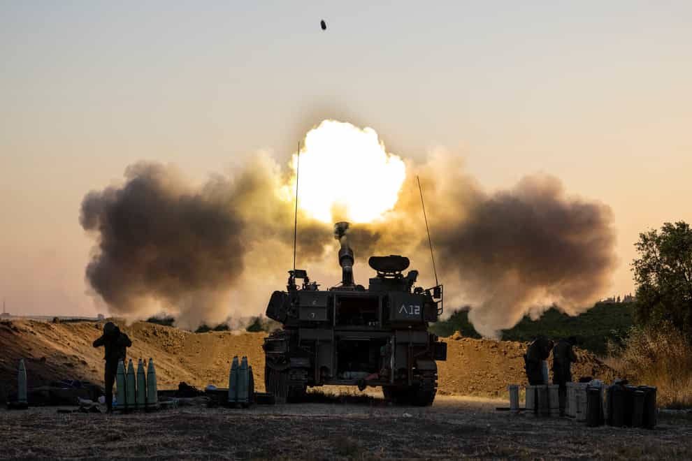 An Israeli artillery unit fires shells towards targets in the Gaza Strip