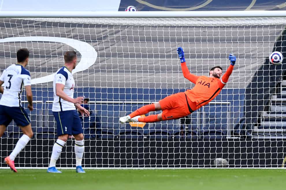 Hugo Lloris dives in vain as Tottenham team-mate Sergio Reguilon, left, scores an own goal against Aston Villa