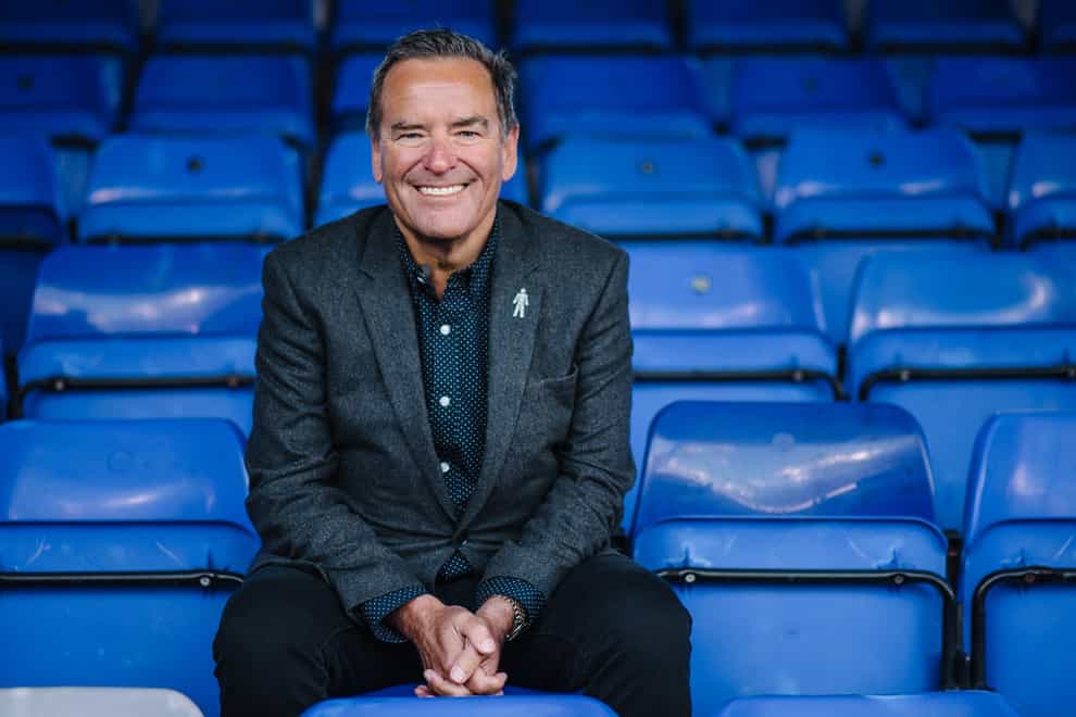 Sky Sports presenter Jeff Stelling sits in the stands