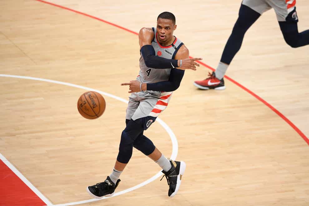 Washington Wizards guard Russell Westbrook passes the ball during the first half of the team’s NBA basketball Eastern Conference play-in game against the Indiana Pacers