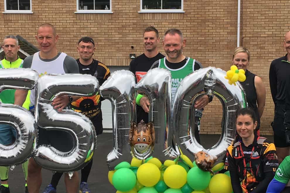 Fundraiser Gary McKee with supporters before setting off on the final marathon of his 110-day challenge