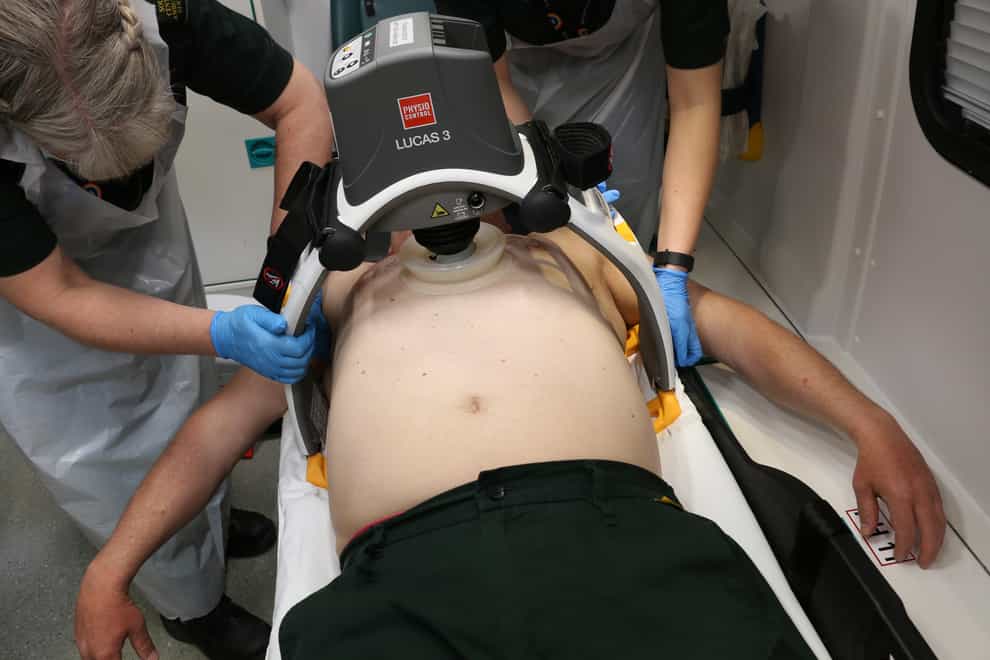 A 'robot paramedic' carries out chest compressions on a patient in an ambulance