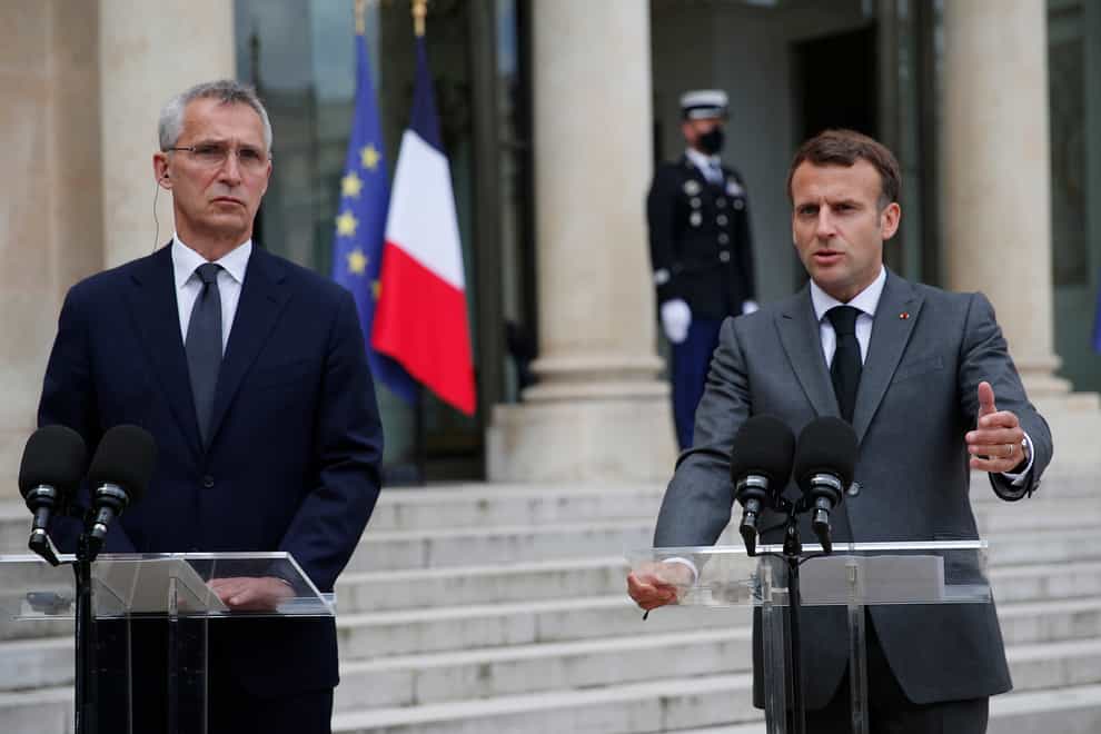 Nato chief Jens Stoltenberg with Emmanuel Macron, president of France (Francois Mori/AP)