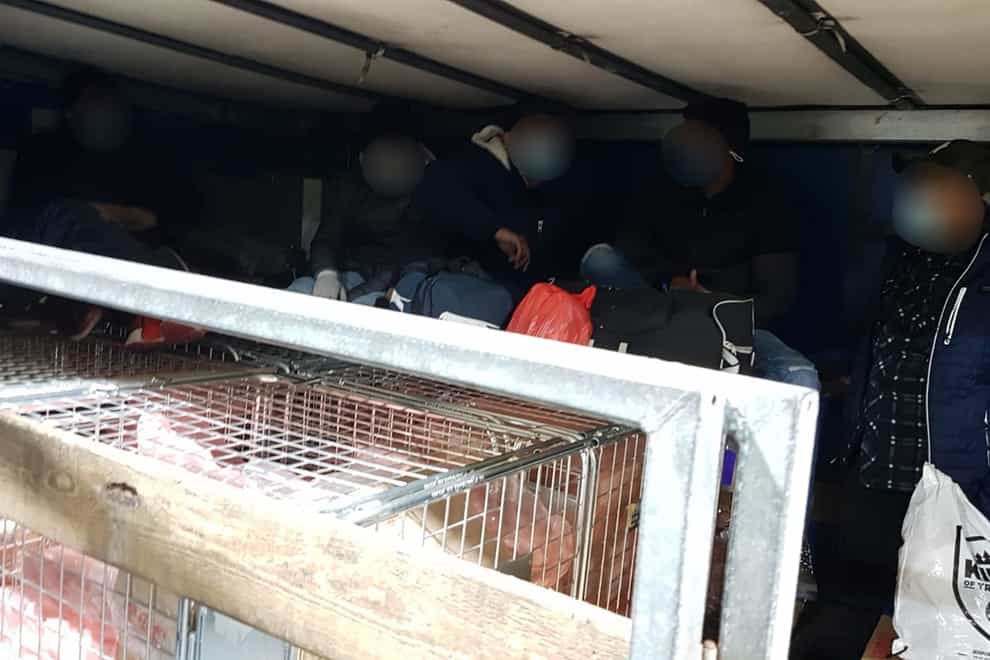 A group of migrants found in the vehicle of Romanian lorry driver Sebastian Gabriel Podar (NCA/PA)
