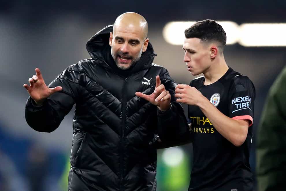 Phil Foden (right) is thriving under Pep Guardiola (left)