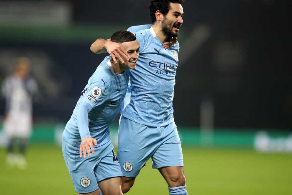 Ilkay Gundogan, right, has been impressed by Phil Foden's form this season