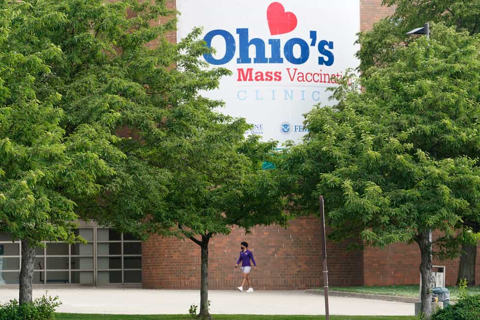 A man walks to the entrance of Ohio’s Covid-19 mass vaccination clinic at Cleveland State University