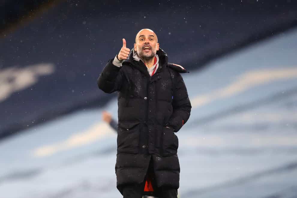 Manchester City manager Pep Guardiola gives a thumbs up gesture