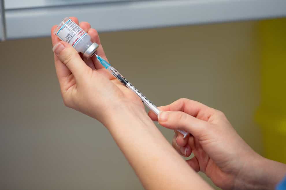 A nurse prepares a Covid-19 vaccination