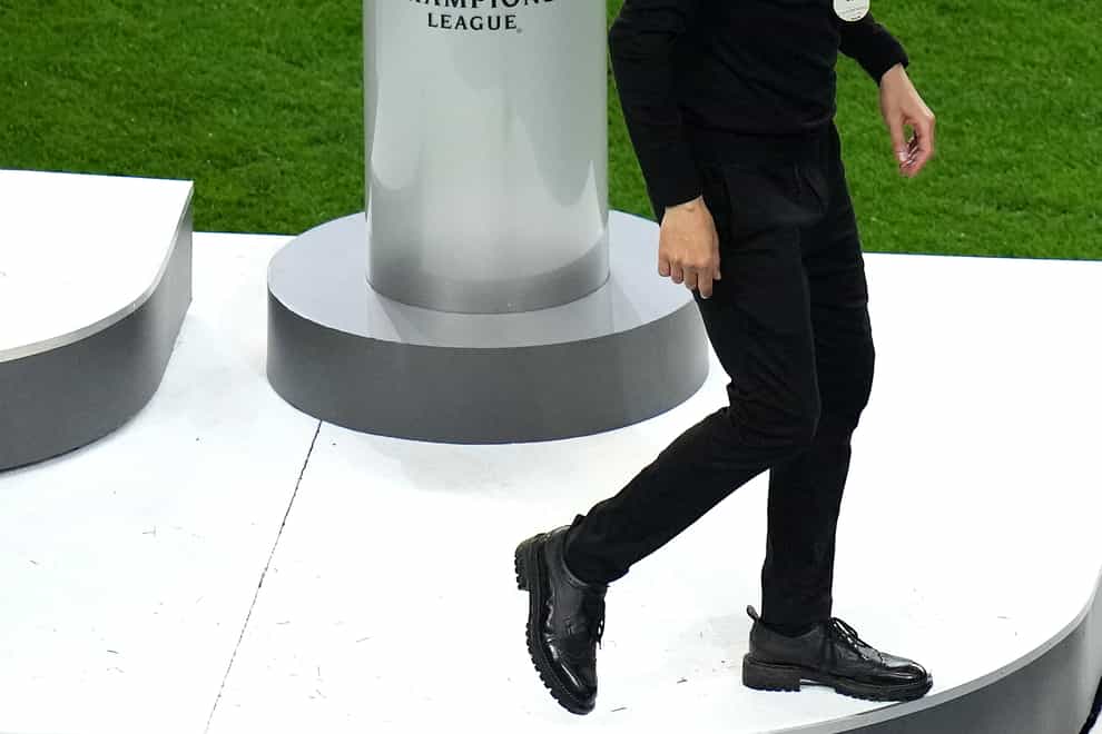 Pep Guardiola, pictured, has to walk past the Champions League trophy after Manchester City's defeat by Chelsea in Porto