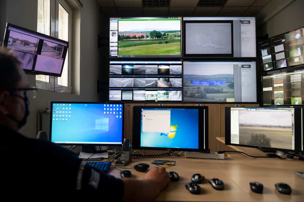 A police officer works inside the operation centre at the village of Nea Vyssa, near the Greek-Turkish border, in Greece