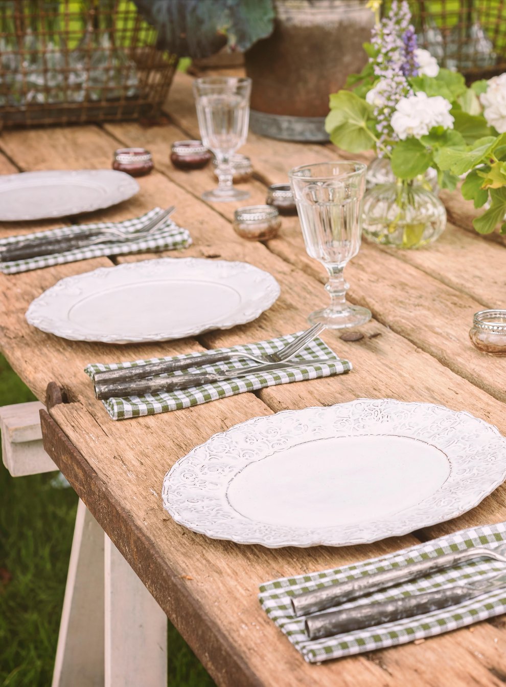 Wooden table set up for a garden party