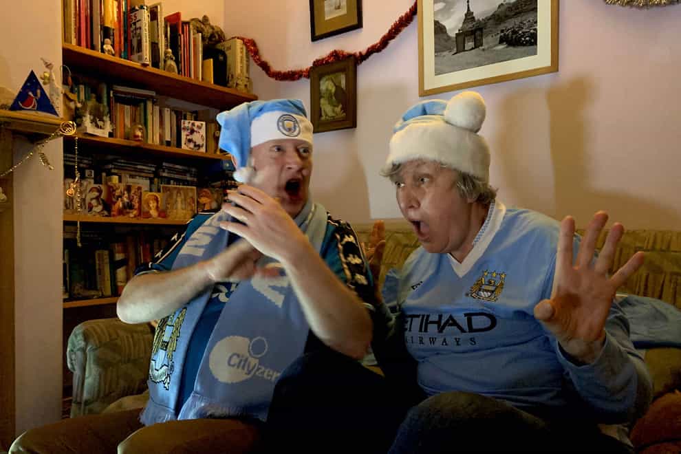Lifelong Manchester City fans Cath and Dougal Brice react as Che Adams goes close for Southampton in a match shown live by Amazon on December 19, 2020. The picture is part of a new Homes Of Football exhibition at the National Football Museum in Manchester