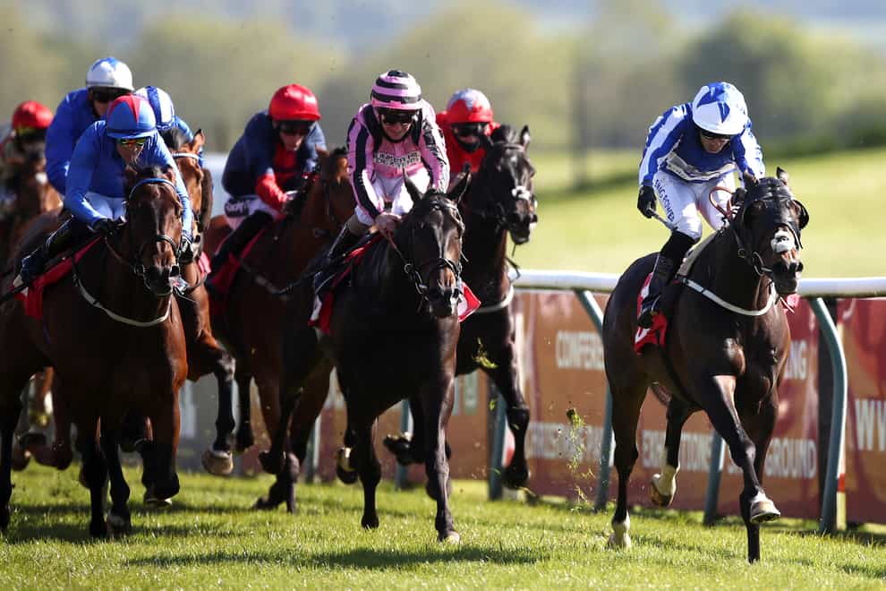 Good Birthday and Silvestre de Sousa (right) take command in the Racing TV Zetland Gold Cup Handicap at Redcar